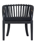 Makena chair in black rattan with a linen seat cushion, featuring a curved backrest and sturdy timber frame, perfect for a relaxed dining setting