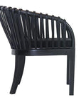 Makena chair in black rattan with a linen seat cushion, featuring a curved backrest and sturdy timber frame, perfect for a relaxed dining setting