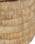 Mara natural handwoven storage basket with integrated handles in warm textured fibre set on a neutral background