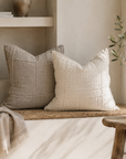 Meadow cushions in Natural and Ivory styled together on a built in bench, bringing soft texture, layered warmth and a relaxed coastal aesthetic to the space.