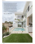 A serene modern coastal outdoor living space featuring a private pool, lush greenery, and a stylish alfresco dining area with Kulala Living outdoor furniture. Designed for relaxation and entertaining, this contemporary setting seamlessly blends indoor and outdoor living