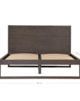 A sleek modern bed frame crafted from dark oak, featuring a minimalist open-base design. The bed is styled with crisp white linen and plush pillows, offering a refined and contemporary bedroom aesthetic