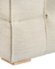 Contemporary modular sofa with a left armrest, upholstered in soft natural linen fabric, featuring plush cushions and sturdy wooden legs for a relaxed, sophisticated look