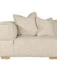 Contemporary modular sofa with a left armrest, upholstered in soft natural linen fabric, featuring plush cushions and sturdy wooden legs for a relaxed, sophisticated look