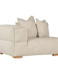 Contemporary modular sofa with a left armrest, upholstered in soft natural linen fabric, featuring plush cushions and sturdy wooden legs for a relaxed, sophisticated look