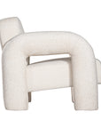 A modern sculptural armchair with rounded, chunky arms and backrest, upholstered in soft white boucle fabric, perfect for contemporary living spaces