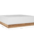 A contemporary white coffee table with a rustic wooden base, featuring a minimalist block design. This versatile piece blends modern aesthetics with organic textures, perfect for living spaces that embrace natural materials and clean lines