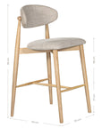 Contemporary wooden barstool with a natural timber frame and an upholstered seat and backrest in neutral fabric, blending comfort and style for modern interiors.