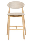 Contemporary wooden barstool with a natural timber frame and an upholstered seat and backrest in neutral fabric, blending comfort and style for modern interiors.