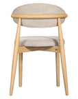 Contemporary wooden dining chair with a natural timber frame and an upholstered seat and backrest in neutral fabric, blending comfort and style for modern interiors.