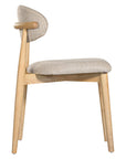 Contemporary wooden dining chair with a natural timber frame and an upholstered seat and backrest in neutral fabric, blending comfort and style for modern interiors.