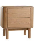 Molly Bedside Table in natural oak with rounded edges and two drawers, styled in a minimalist bedroom setting