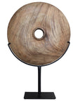 Natural carved teak disc sculpture with stand in modern minimalist design, perfect for adding bold decorative accents to any interior space