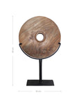 Natural carved teak disc sculpture with stand in modern minimalist design, perfect for adding bold decorative accents to any interior space
