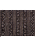 A black and natural handwoven bedhead featuring intricate geometric patterns, crafted from durable natural fibres for a timeless and earthy aesthetic.