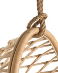 A stylish natural hanging chair with an open-weave design, suspended by a natural rope and featuring a plush white cushion for ultimate relaxation