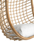 A stylish natural hanging chair with an open-weave design, suspended by a natural rope and featuring a plush white cushion for ultimate relaxation