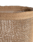Natural jute storage baskets with open weave design, perfect for stylish organisation and coastal decor.