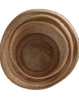 Natural jute storage baskets with open weave design, perfect for stylish organisation and coastal decor.