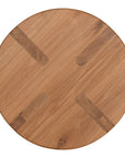 A sleek natural oak round stool featuring a minimalist design with subtly curved legs. Crafted from solid oak with a clear finish, this versatile piece functions as a stool or side table, adding a modern touch to any space