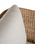Natural rattan swivel armchair with plush barley cushions, offering a blend of comfort and contemporary coastal style