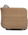 Natural rattan swivel armchair with plush barley cushions, offering a blend of comfort and contemporary coastal style