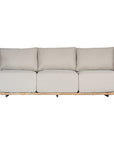 Natural rattan three seater with plush barley cushions, offering a blend of comfort and contemporary coastal style