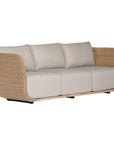 Natural rattan three seater with plush barley cushions, offering a blend of comfort and contemporary coastal style