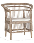 A beautifully crafted natural rattan armchair with an open-weave design and a white cushioned seat, perfect for adding a relaxed coastal touch to any space.