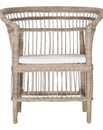 A beautifully crafted natural rattan armchair with an open-weave design and a white cushioned seat, perfect for adding a relaxed coastal touch to any space.