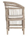 A beautifully crafted natural rattan armchair with an open-weave design and a white cushioned seat, perfect for adding a relaxed coastal touch to any space.