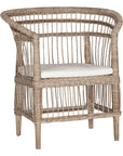 A beautifully crafted natural rattan armchair with an open-weave design and a white cushioned seat, perfect for adding a relaxed coastal touch to any space.
