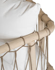 Natural rope lounge chair with white cushions, featuring a light timber frame and modern coastal aesthetic.