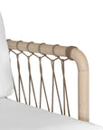 Natural rope lounge chair with white cushions, featuring a light timber frame and modern coastal aesthetic.