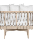 Natural rope lounge chair with white cushions, featuring a light timber frame and modern coastal aesthetic.