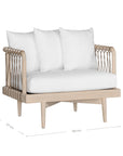 Natural rope lounge chair with white cushions, featuring a light timber frame and modern coastal aesthetic.