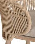 Handwoven rope counter stool with a curved backrest, cushioned seat, and sturdy wooden legs, perfect for relaxed coastal and modern interiors