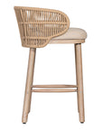 Handwoven rope counter stool with a curved backrest, cushioned seat, and sturdy wooden legs, perfect for relaxed coastal and modern interiors