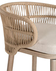Handwoven rope bar stool with a curved backrest, cushioned seat, and sturdy wooden legs, perfect for relaxed coastal and modern interiors