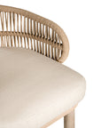 Handwoven rope bar stool with a curved backrest, cushioned seat, and sturdy wooden legs, perfect for relaxed coastal and modern interiors
