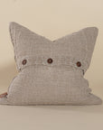 Natural linen cushion with a textured finish in a soft, neutral tone, perfect for adding warmth and comfort to any living space