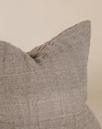 Natural linen cushion with a textured finish in a soft, neutral tone, perfect for adding warmth and comfort to any living space