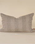 Natural linen cushion with a textured finish in a soft, neutral tone, perfect for adding warmth and comfort to any living space.