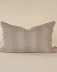 Natural linen cushion with a textured finish in a soft, neutral tone, perfect for adding warmth and comfort to any living space.