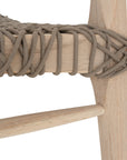 Natural wooden dining chair with a woven seat, showcasing a minimalist and rustic design perfect for modern interiors.