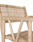 Natural rattan armchair with rustic branch frame, perfect for adding a touch of organic texture to any dining space