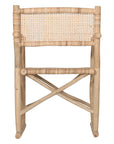 Natural rattan armchair with rustic branch frame, perfect for adding a touch of organic texture to any dining space