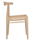 Natural timber dining chair with woven cane seat and curved backrest, ideal for relaxed, coastal-inspired dining spaces