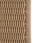 Bar stool crafted from natural wood with a curved backrest and handwoven rope seat, blending organic textures with a modern silhouette