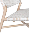 A stylish natural wood occasional chair featuring a woven white leather seat and backrest, blending modern design with organic textures.